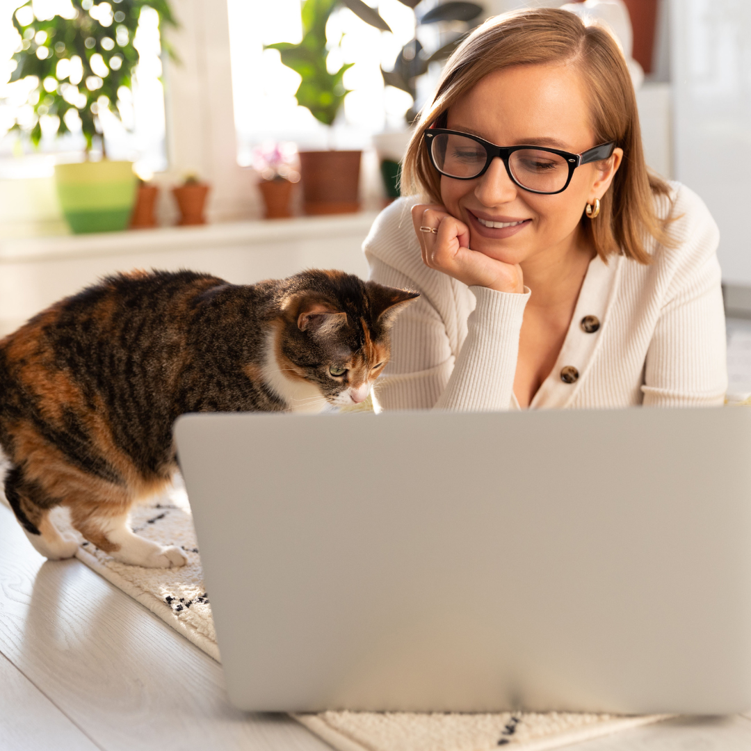 woman on laptop with cat