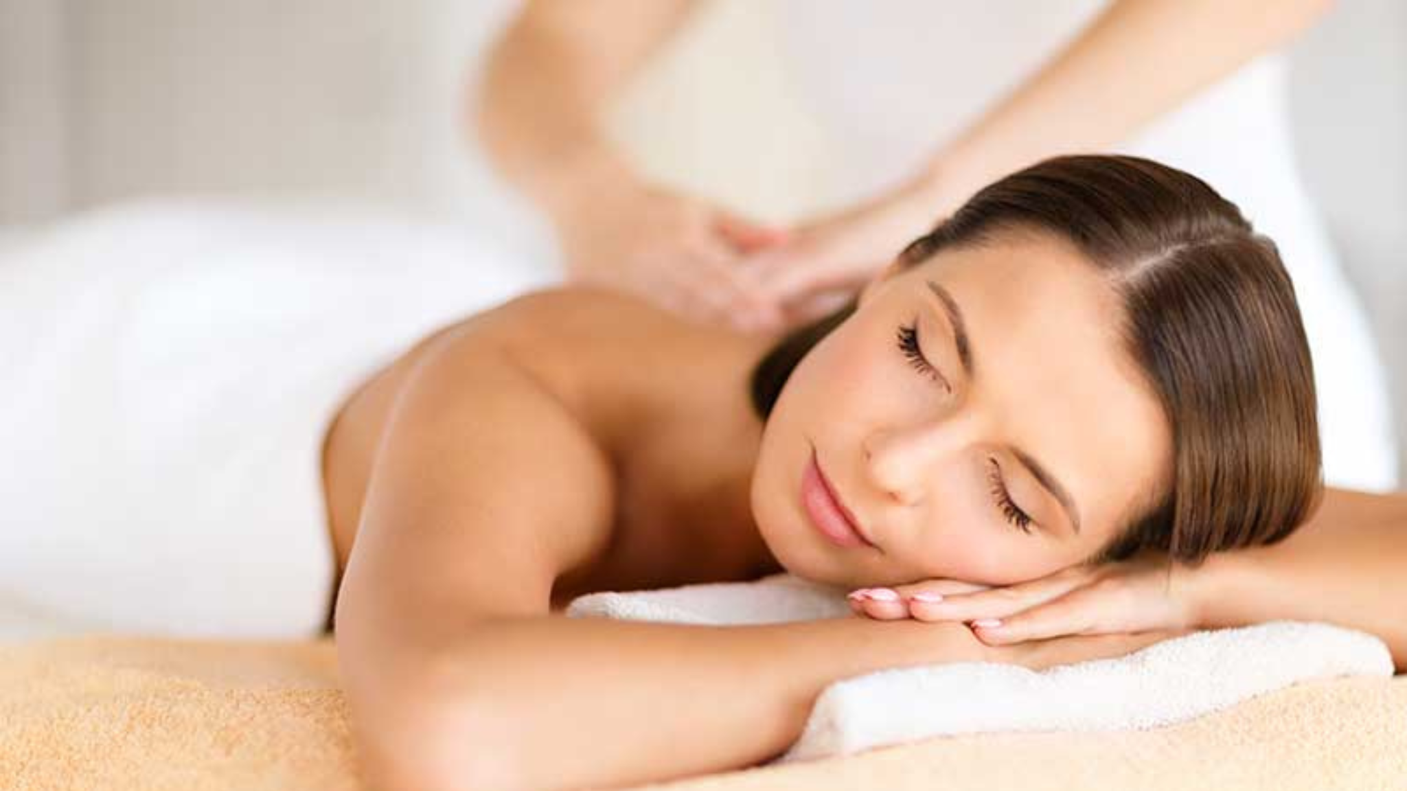 image of woman relaxing while having a massage
