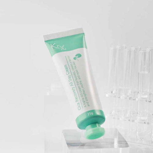 Green and white tube o KrX CICA recovery all day cream  on a white background at heaven on earth aspen