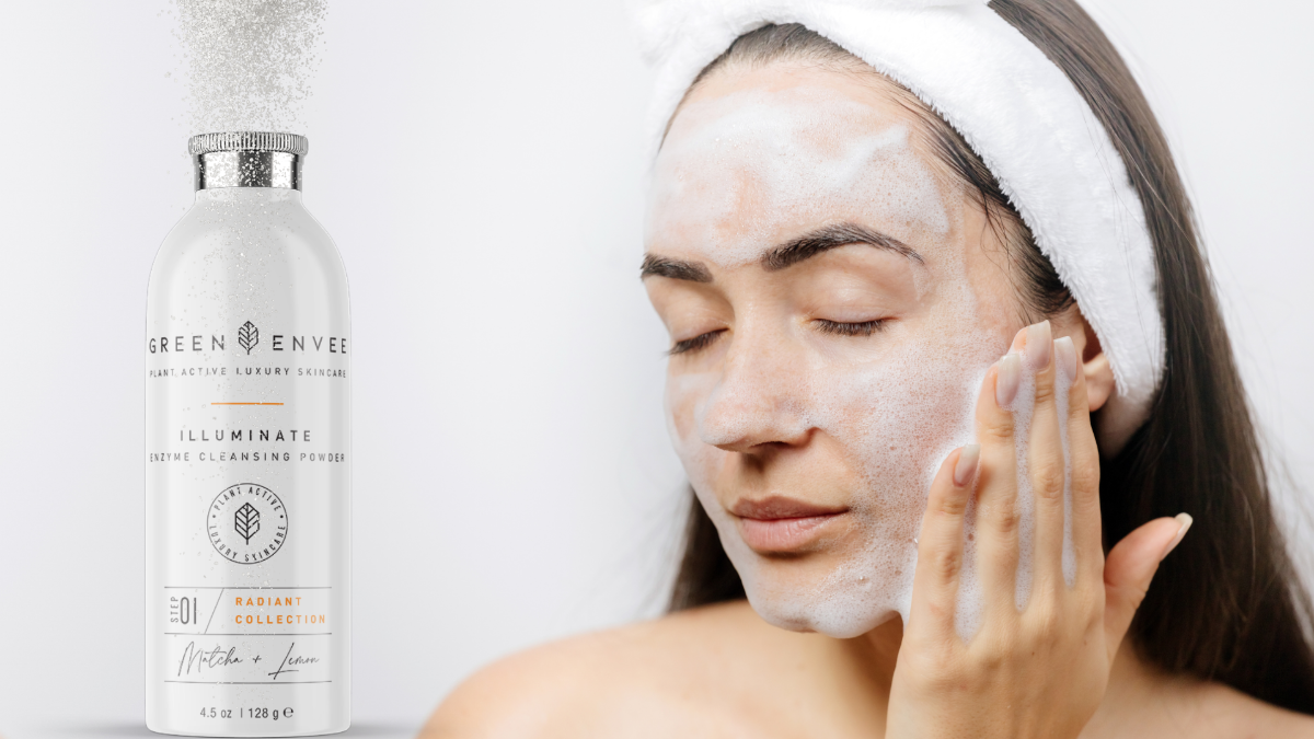 woman washing her face with the green envee cleansing powder at heaven on earth
