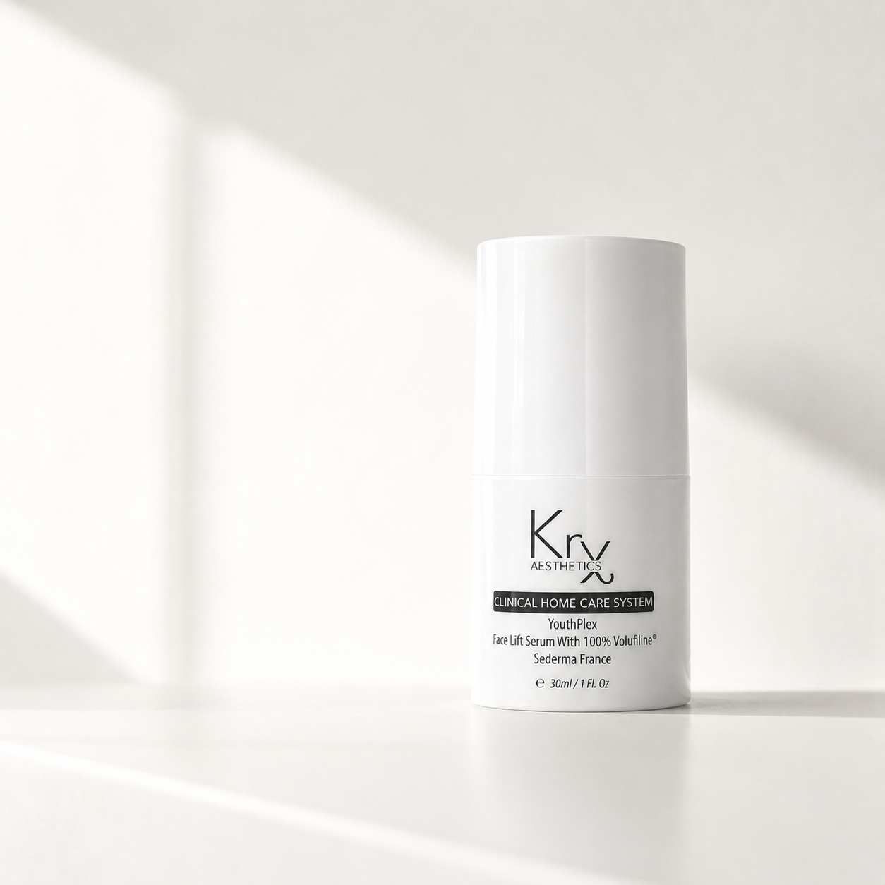 A white cylindrical bottle of Kry Aesthetics YouthPlex Face Lift Serum with 100% Volufiline set against a bright white background with soft diagonal shadows.