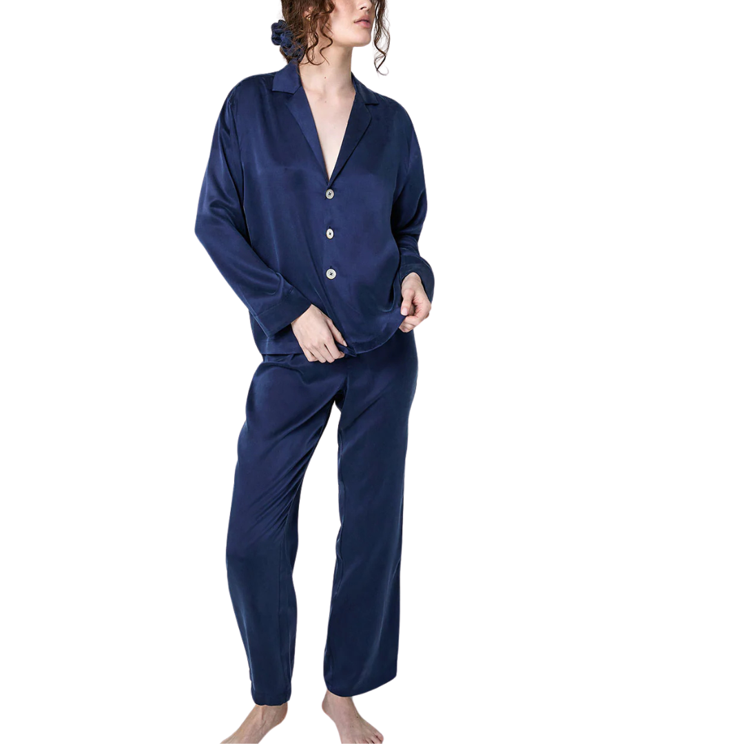 model wearing the lunya washable silk long sleeve pant set in deep blue available at heaven on earth aspen