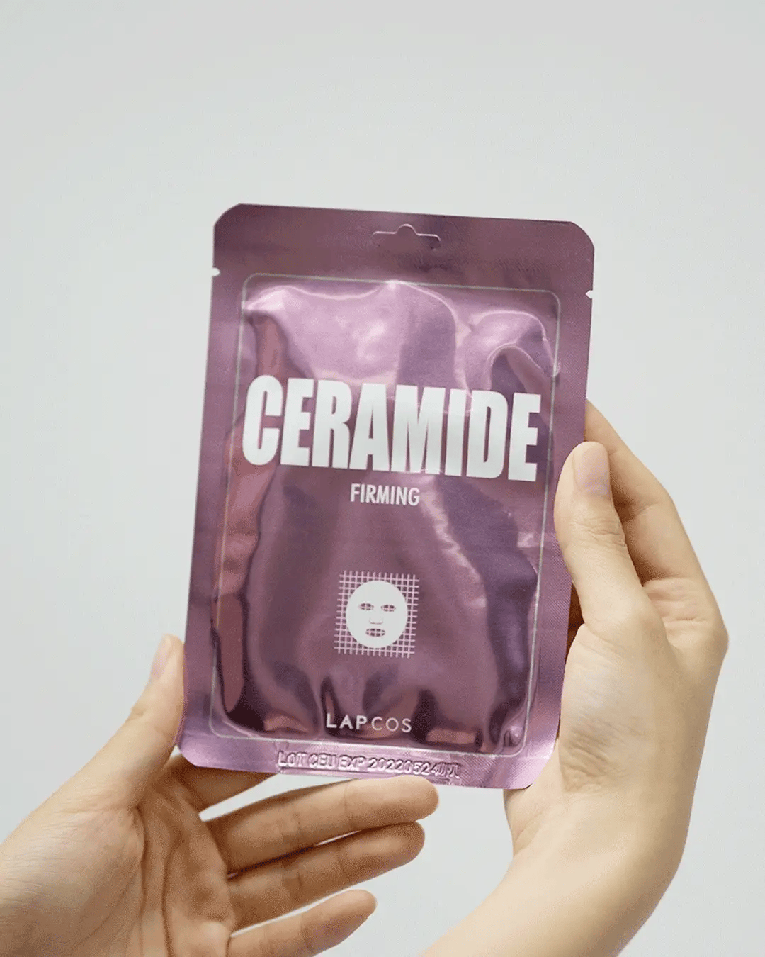 a video showing the juicy sheet mask from lapcos of the daily ceramide mask
