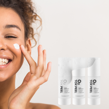 beautiful woman with the o2 tox peel on her skin and three bottles of the dermathod peel with oxygenating bubbles 