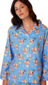 little tabby with a freda khalo flower headband on baby blue flannel pajamas from the cats pajamas at heaven on earth aspen 