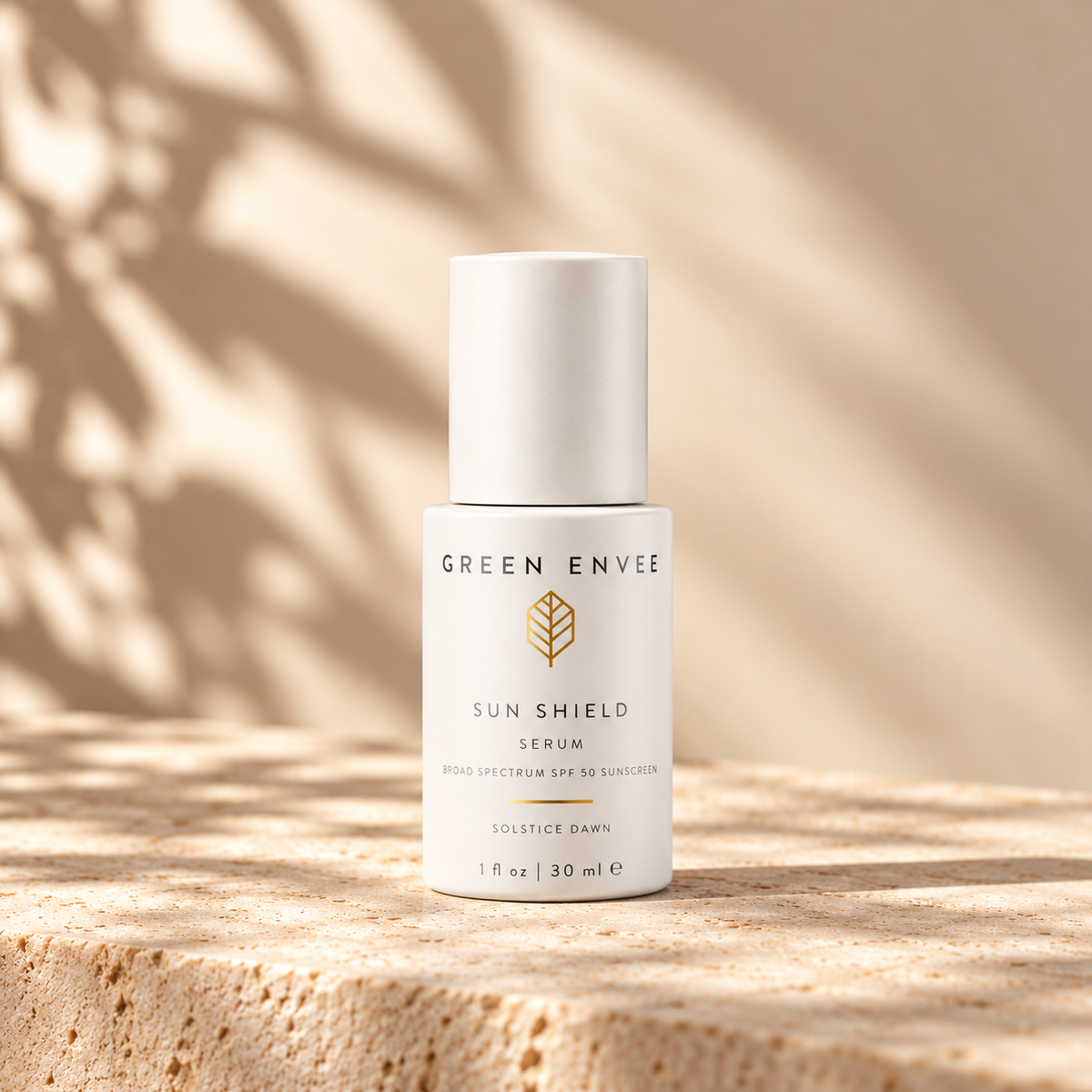 green envee solstice dawn mineral spf on a beige marble slab with shadows behind it 