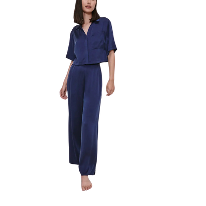 model wearing the lunya washable silk high rise pant set in deep blue sold at heaven on earth