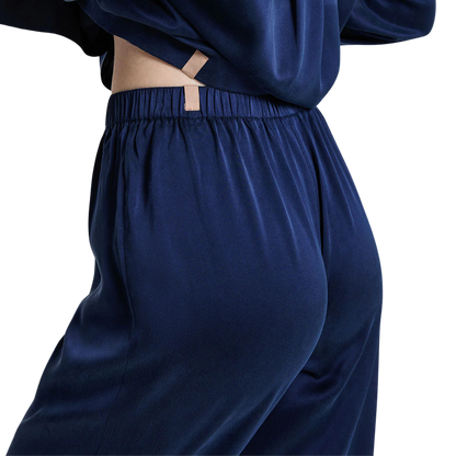 details of the elastic waist bandof the lunya washable silk long sleeve pant set in deep blue available at heaven on earth 