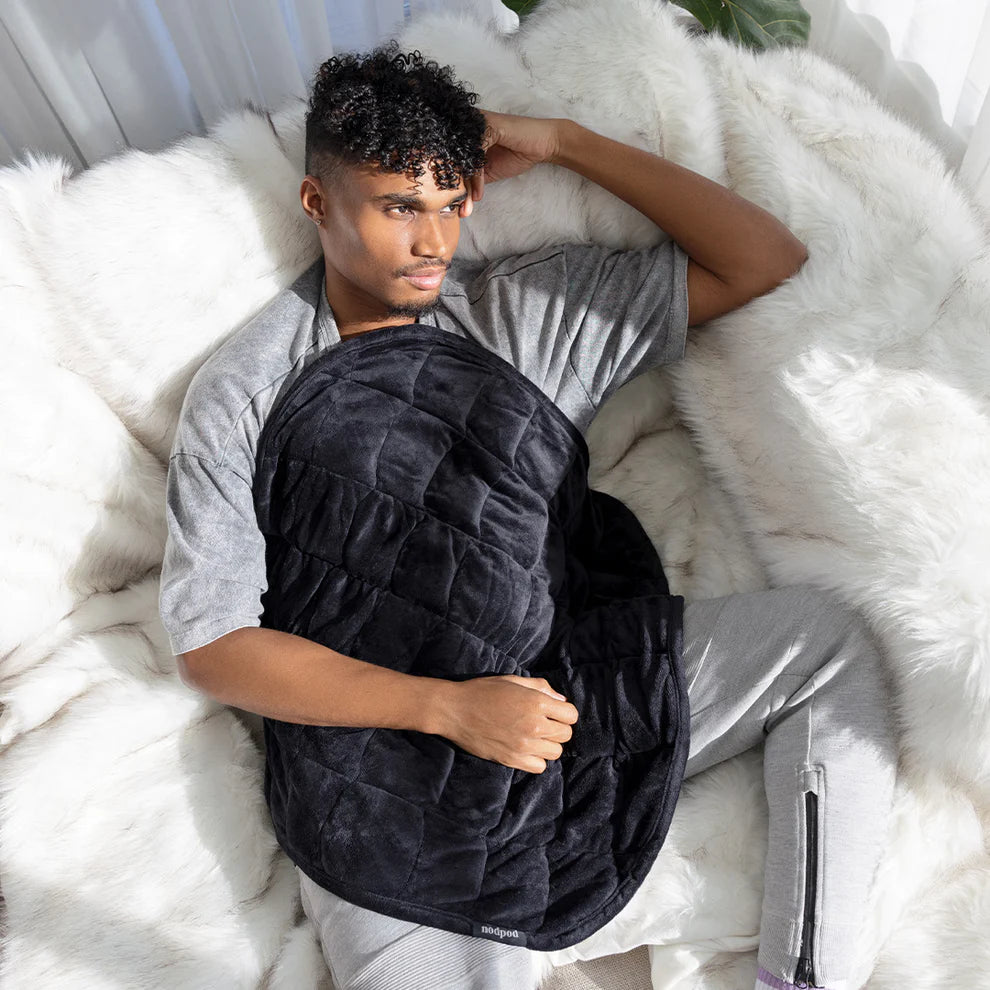 the NodPod weighted blanket in onyx at heaven on earth aspen
