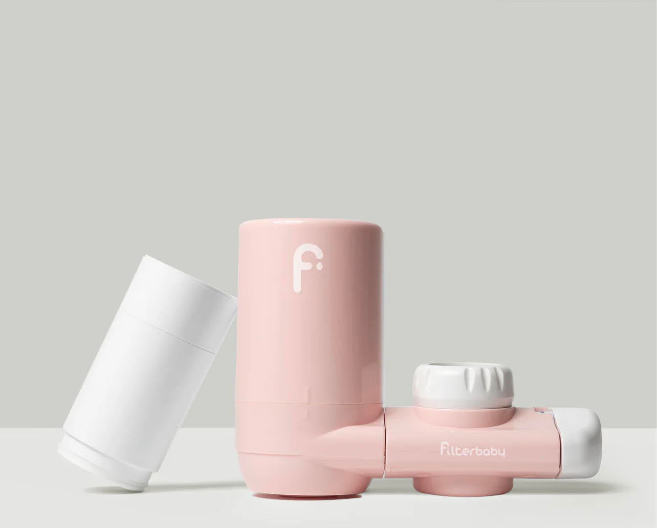 FilterBaby in pink is a skincare water filtration for healhy, happy skin