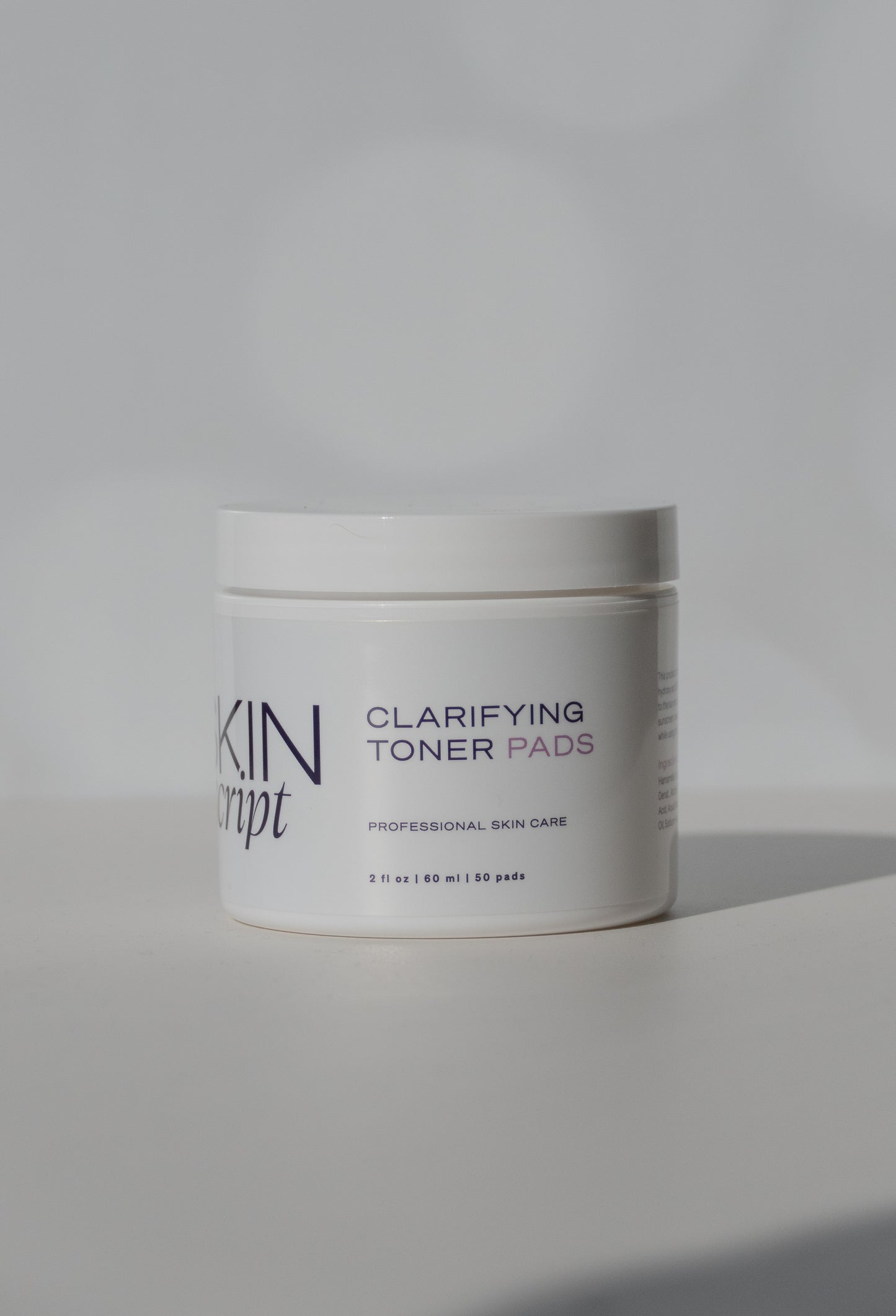 Jar of Skin Script Clarifying Toner Pads on a light gray background - heaven-on-earth-aspen