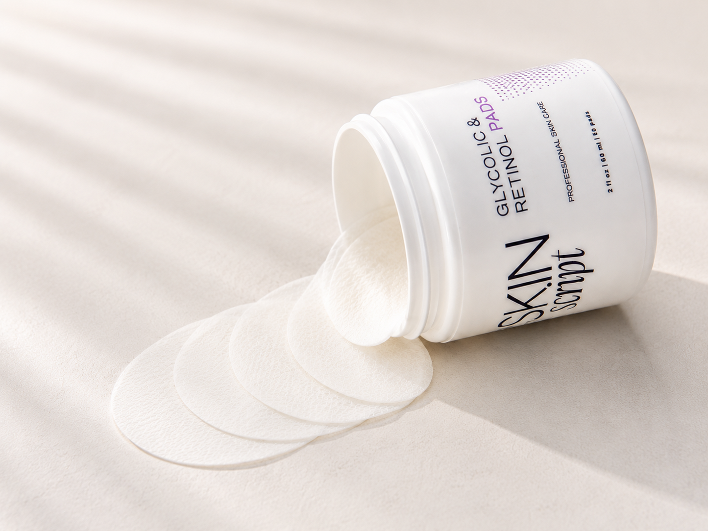 Skin Script jar with glycolic acid pads on a light background