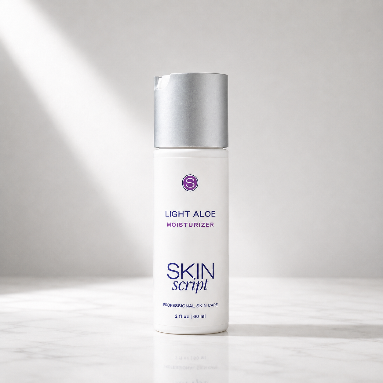 A white bottle of Skin Script Light Aloe Moisturizer with a metallic silver cap, standing on a light marble surface with soft diagonal light rays in the background.
