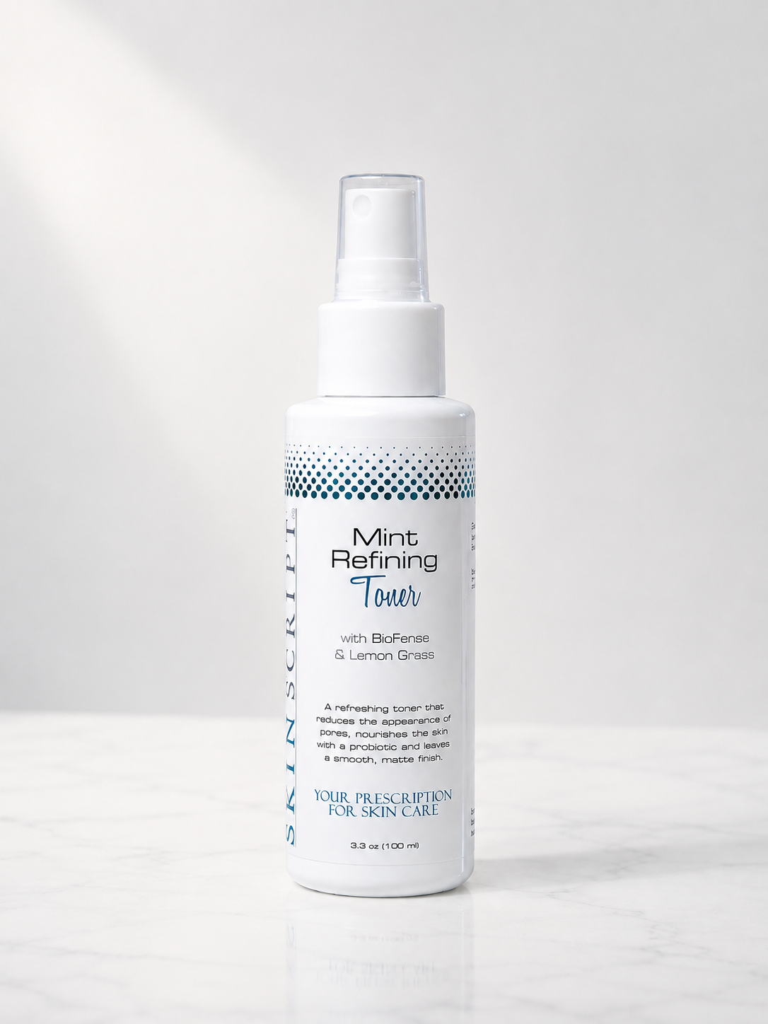 A white spray bottle o Skin Script Mint Refined Toner featuring blue text and a dotted pattern, set against a clean white background with a soft shadow.